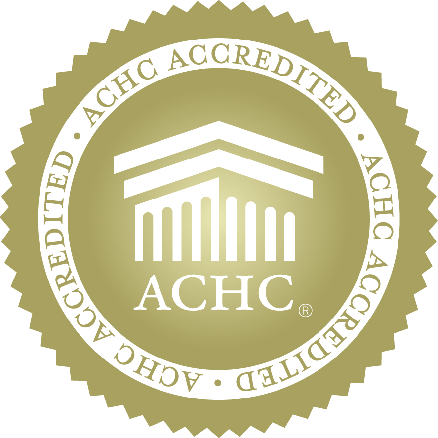 Gold seal with building icon. Text: ACHC ACCREDITED • ACHC®