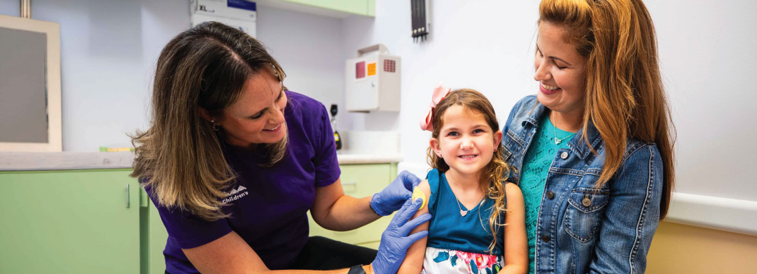 Girl getting vaccine