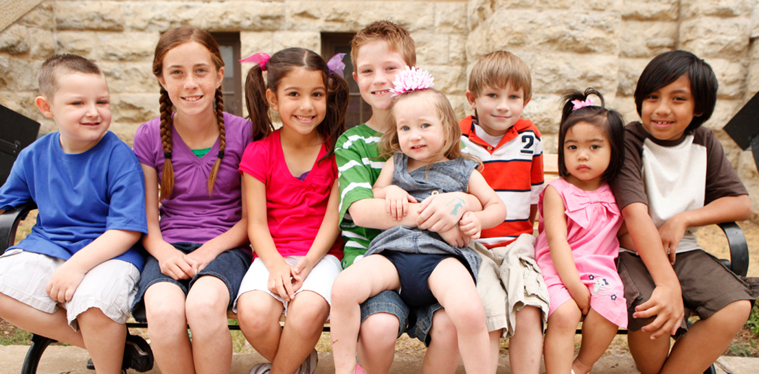 eight kids on a bench