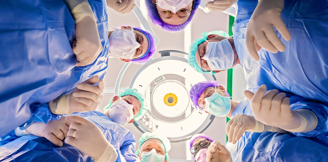 Surgical team in circle from twins' point of view