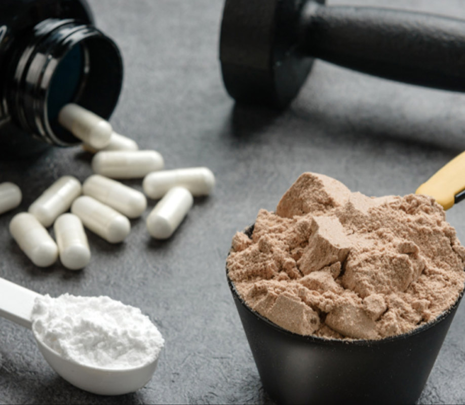 Photo of creatine and protein capsules and powders