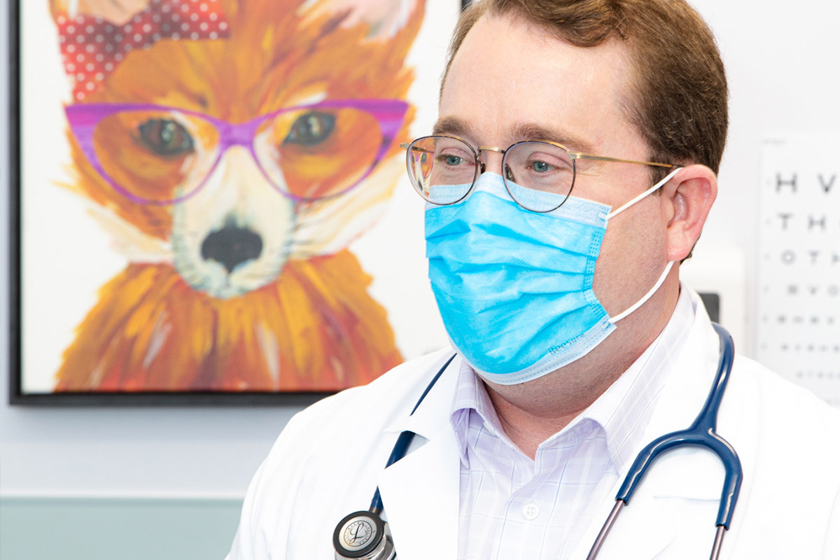 Dr. Todd Johnson with fox painting