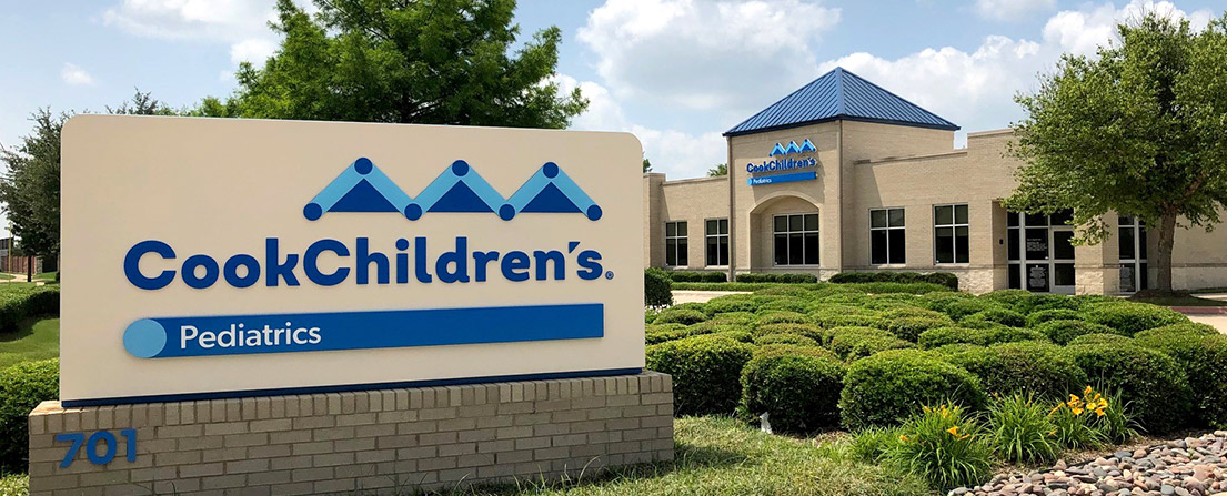 CookChildren's Pediatrics building with a sign reading CookChildren's Pediatrics and the address 701