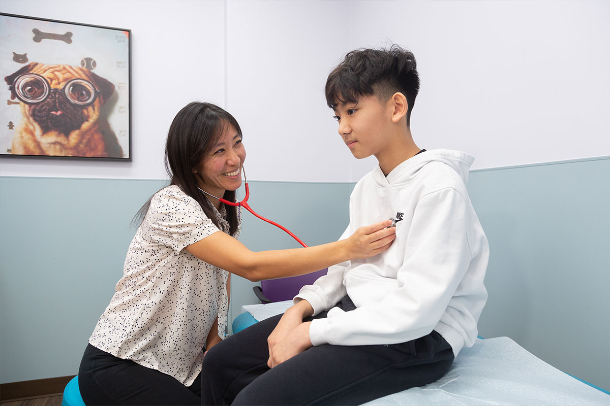 Dr. Hsu examining Boy