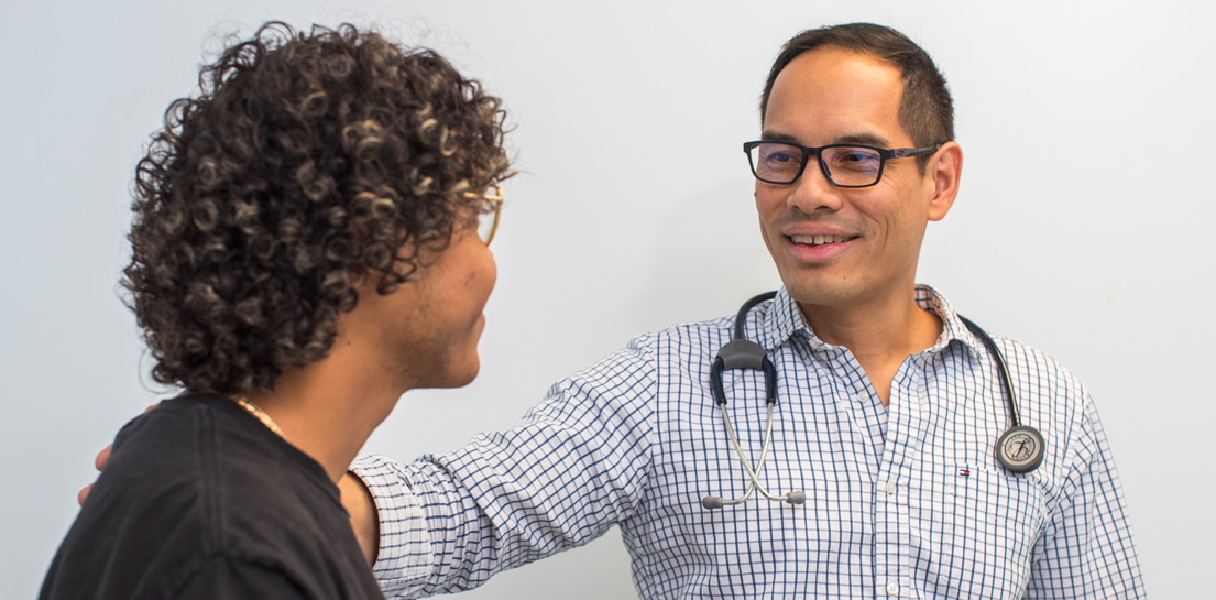Dr. Clifton Huang with patient