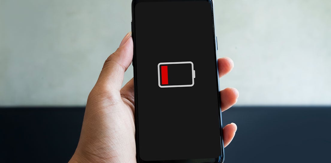Mobile phone with black screen and red low battery icon