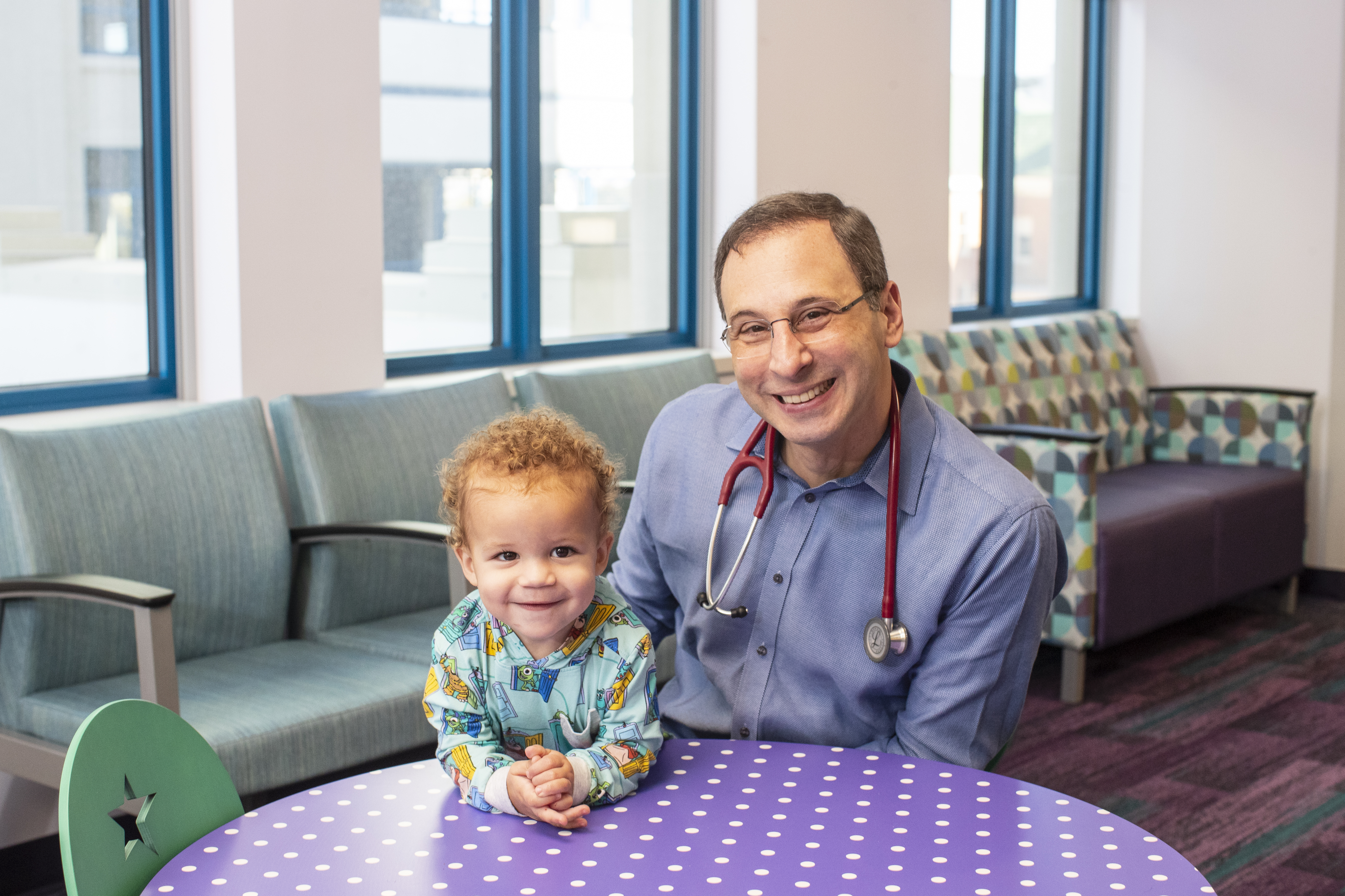 smiling doc and baby